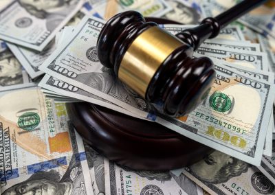 Large,Amount,Of,Dollar,Money,And,A,Judge's,Gavel,On
