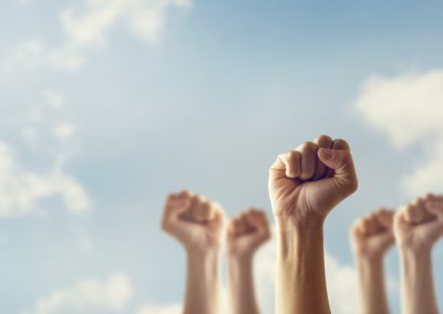 Peoples,Raised,Fist,Air,Fighting,And,Sunlight,Effect,,Competition,,Teamwork