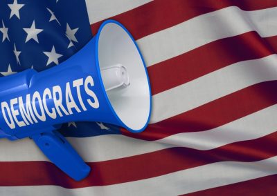 Blue,Megaphone,Loudspeaker,With,Democrats,Text,On,American,Flag.,Concept