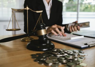 Judges,Gavel,Placed,On,Dollar,Bills,And,Coins,With,A