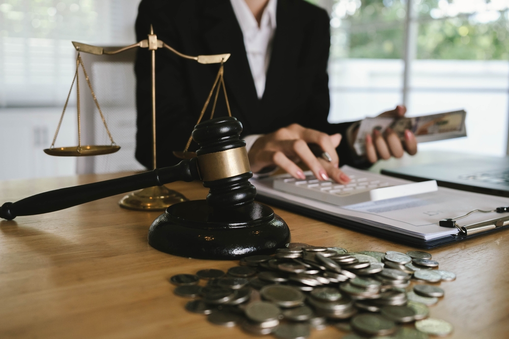 JudgeÂ’s,Gavel,Placed,On,Dollar,Bills,And,Coins,With,A