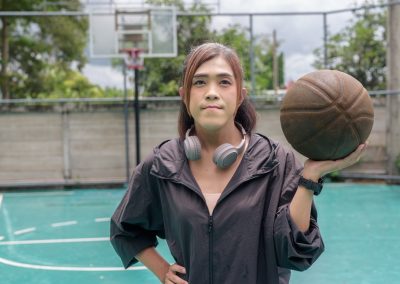 Portrait,Of,A,Fit,Transgender,Woman,Standing,On,Outdoor,Basketball