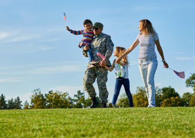 Soldier,With,His,Family,Are,Walking,With,Usa,Flags.,Father