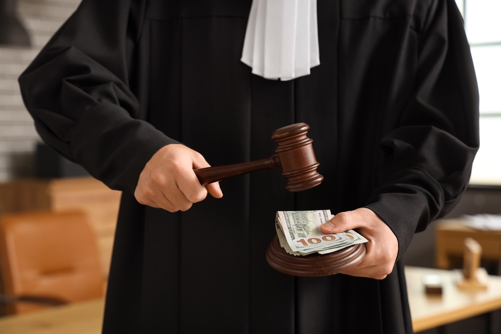 Male,Judge,With,Bribe,And,Gavel,In,Office,,Closeup.,Corruption